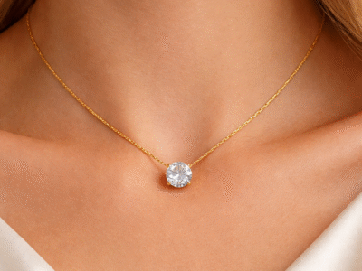 Gold solitaire AD stone pendant necklace worn on neck with minimal elegant styling