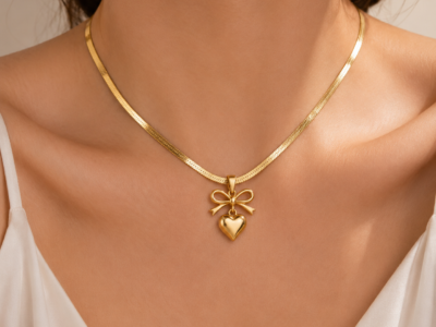 NAMIKA gold bow heart pendant necklace for women crafted from premium stainless steel, anti tarnish, waterproof and hypoallergenic minimalist jewellery for everyday wear.