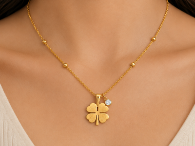 NAMIKA lucky four leaf clover necklace for women featuring a gold stainless steel clover pendant with crystal charm, anti tarnish, waterproof, hypoallergenic minimalist everyday jewellery.