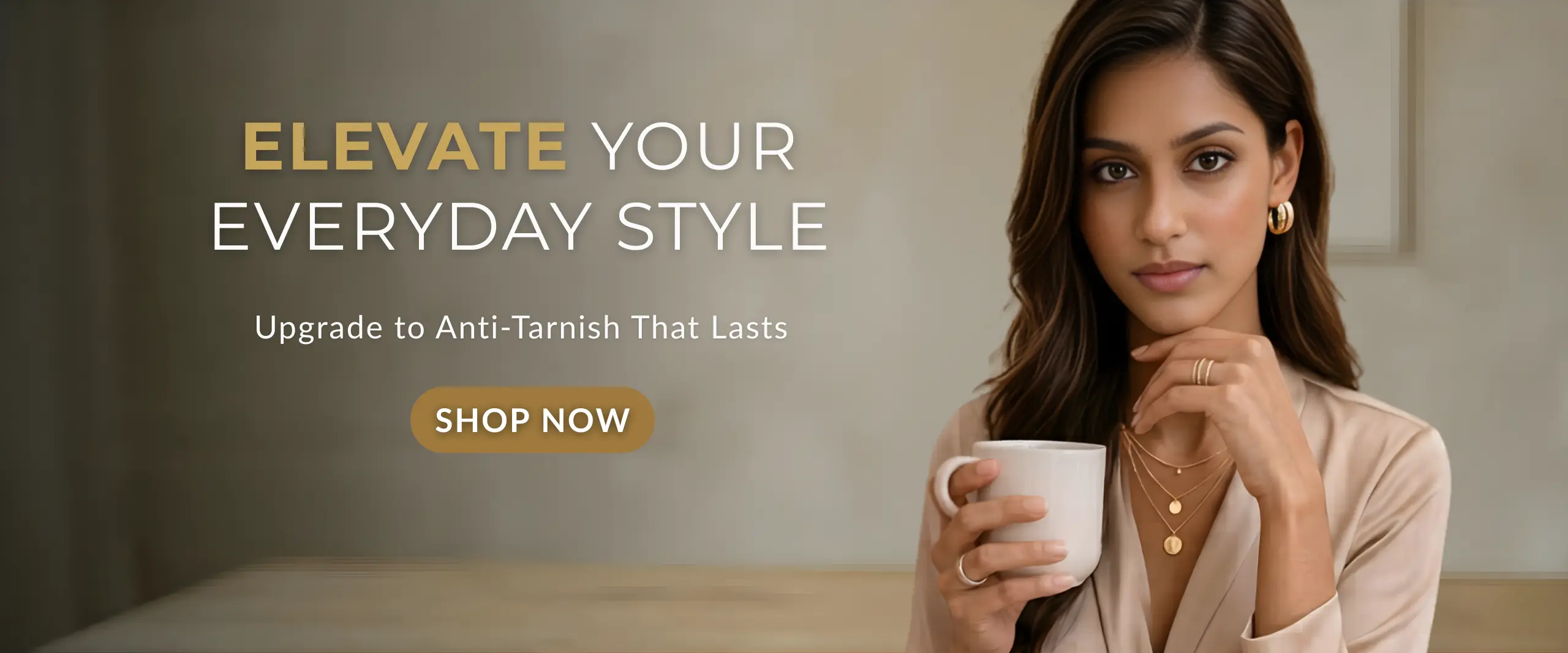 Minimalist anti-tarnish gold jewellery worn by elegant woman, everyday waterproof stainless steel jewellery for modern women